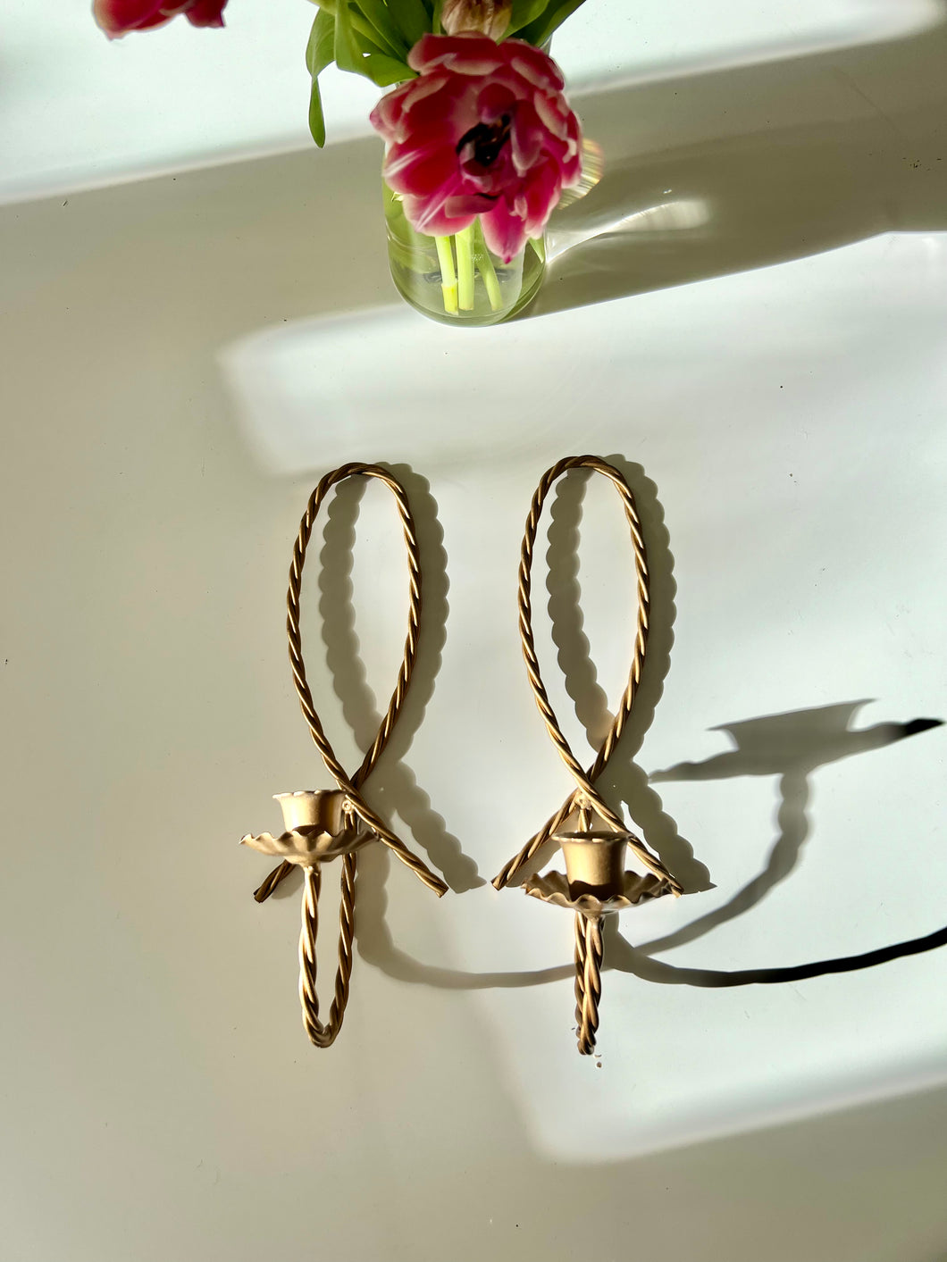 A pairs of vintage brass rope, scalloped edge wall sconces