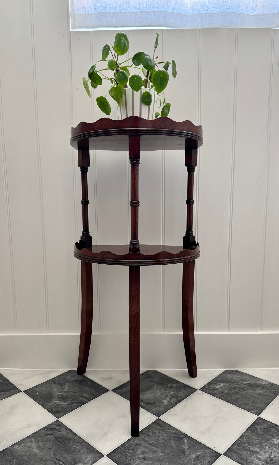 A mahogany scalloped two tier étagère